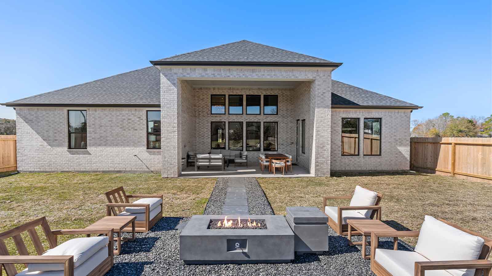 Outdoor fireplace with seating all around for those cozy winter nights