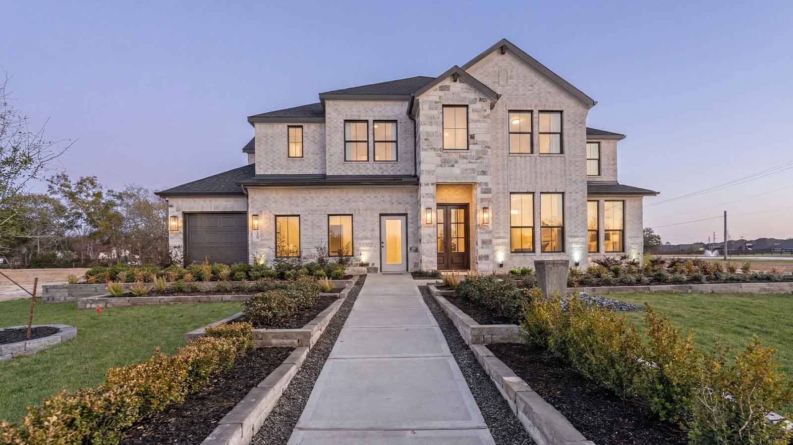 two story home with a three car garage