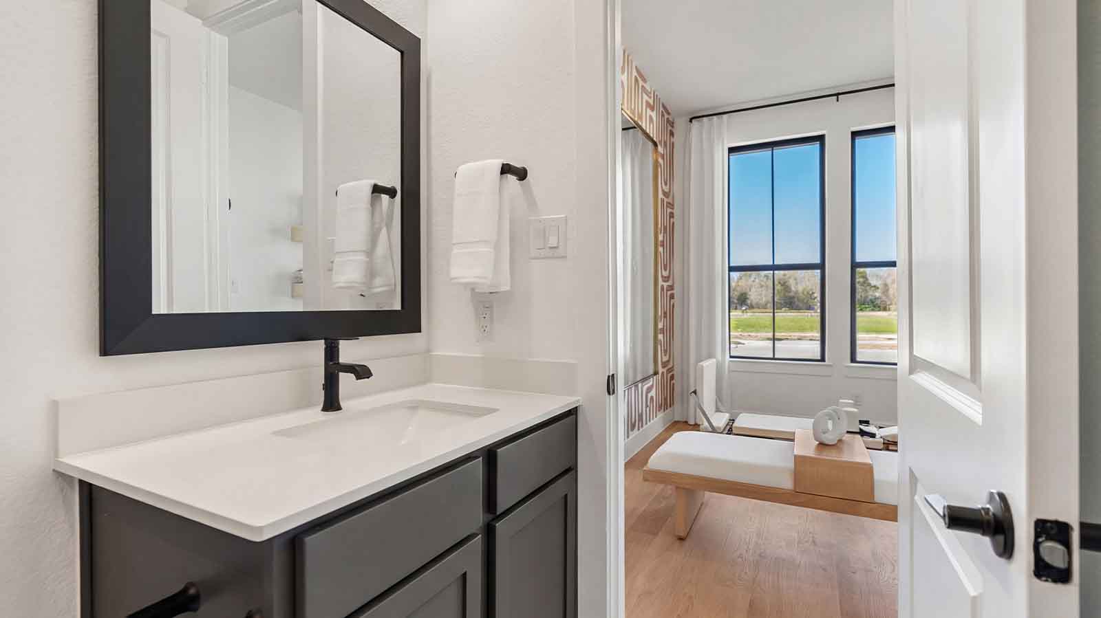 secondar bathroom with one sink and a tub and shower