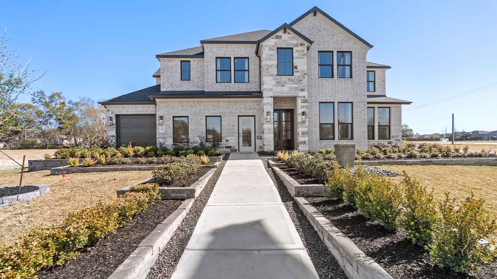 two story home with a three car garage