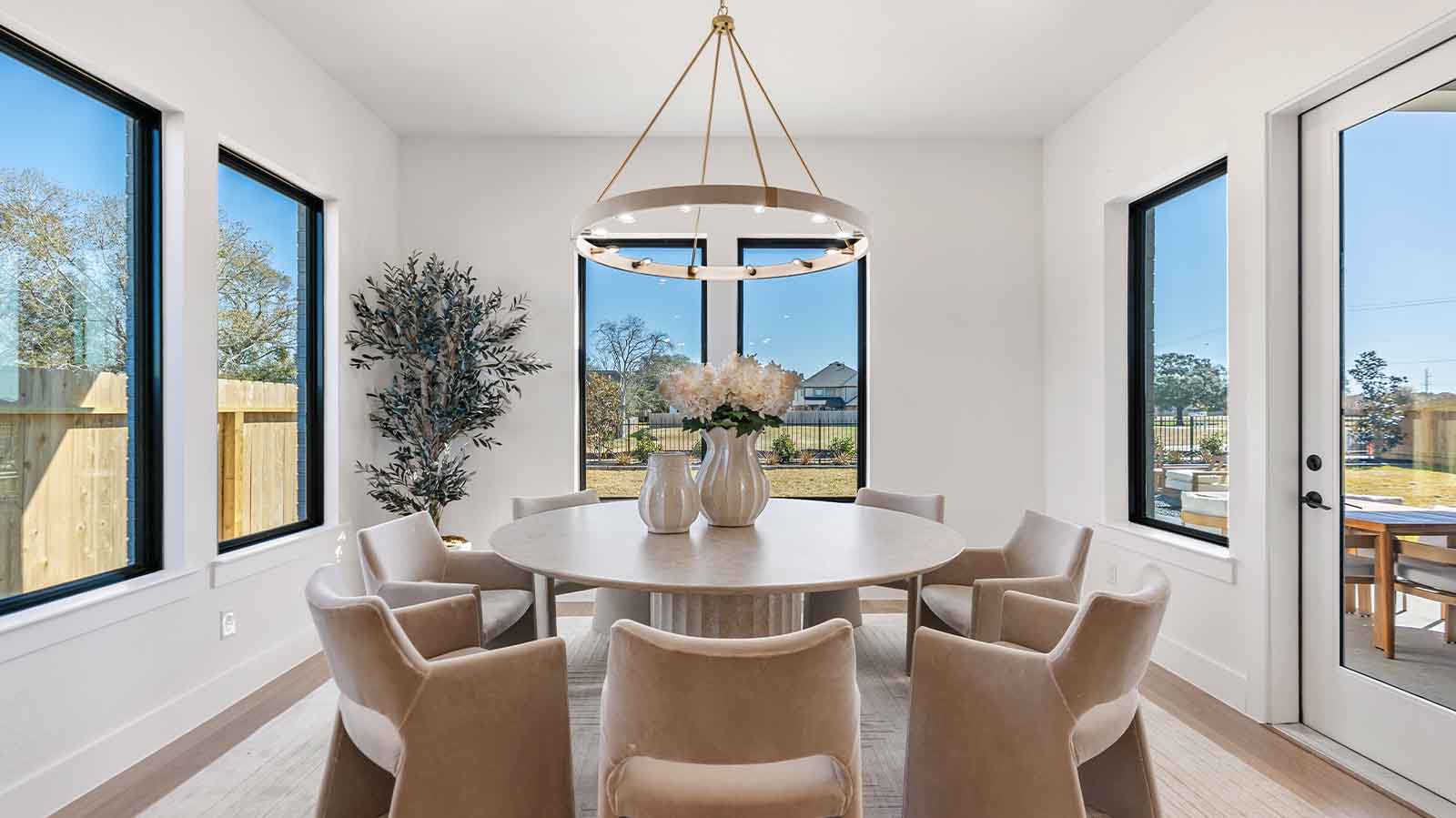 dining room with multiple windows