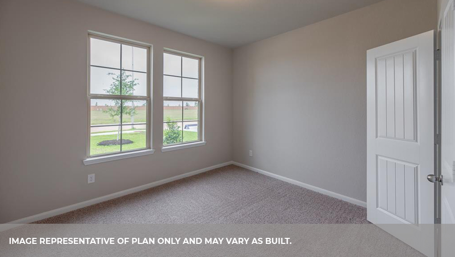 Secondary bedroom with two large windows