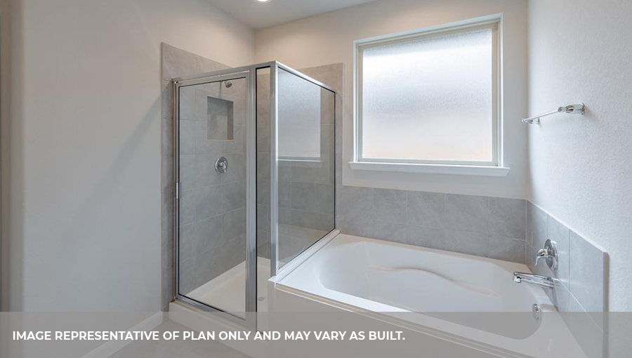 Primary bathroom with a seprate bathtub and shower