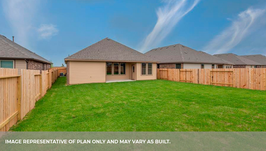 Backyard with sod and a covered back patio