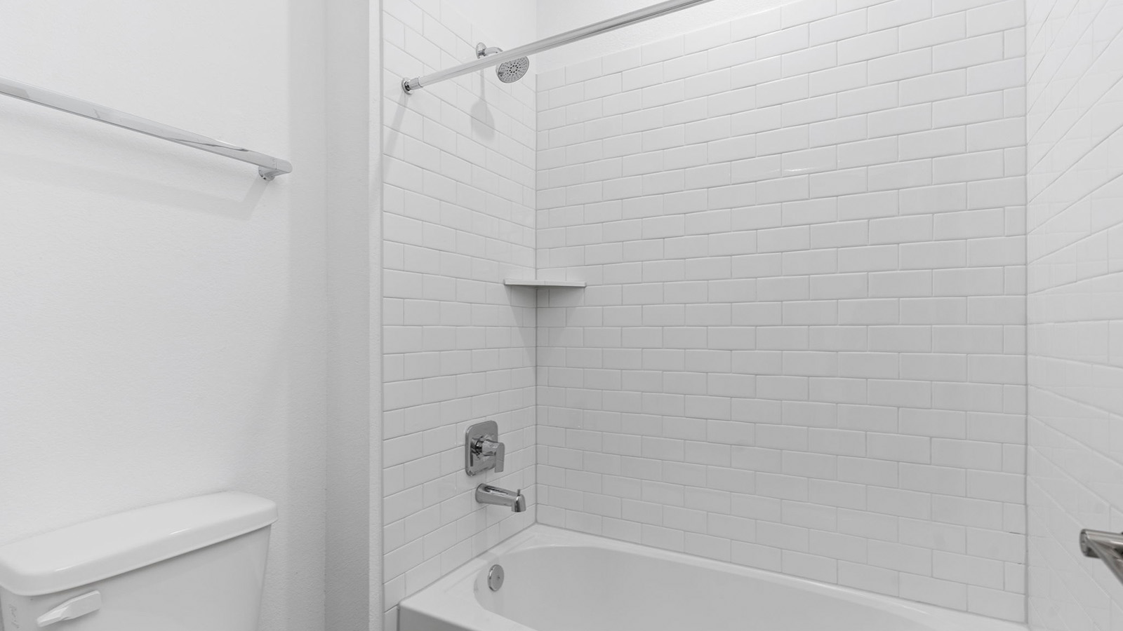 Secondary bathroom with bathtub and shower combo