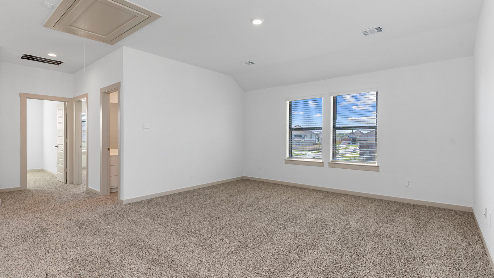 Upstairs game room with two large windows