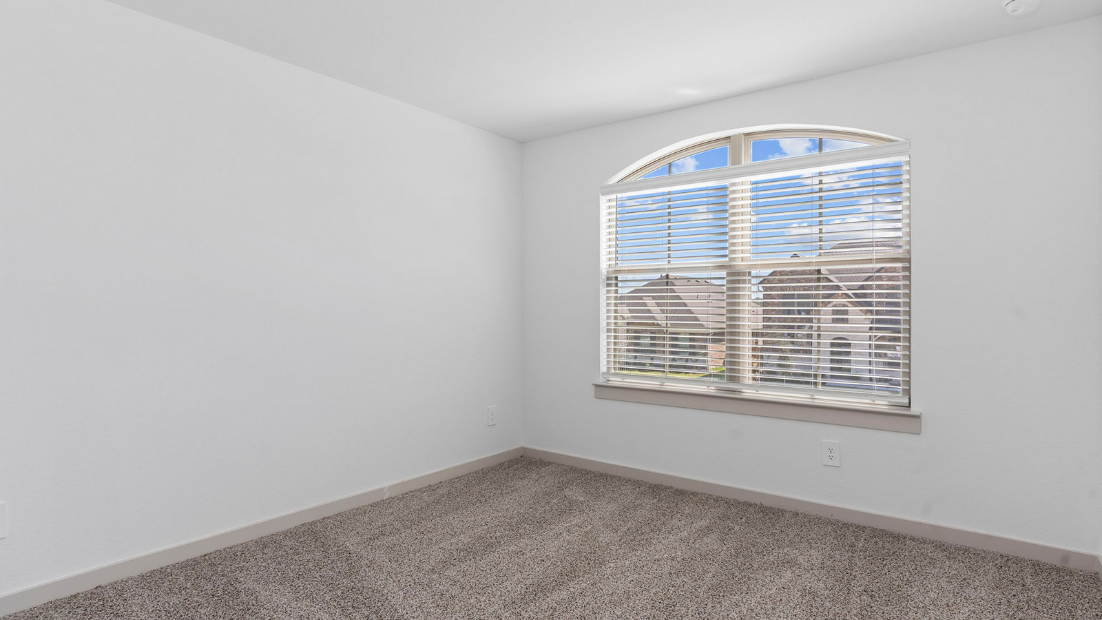Secondary bedroom with two large windows