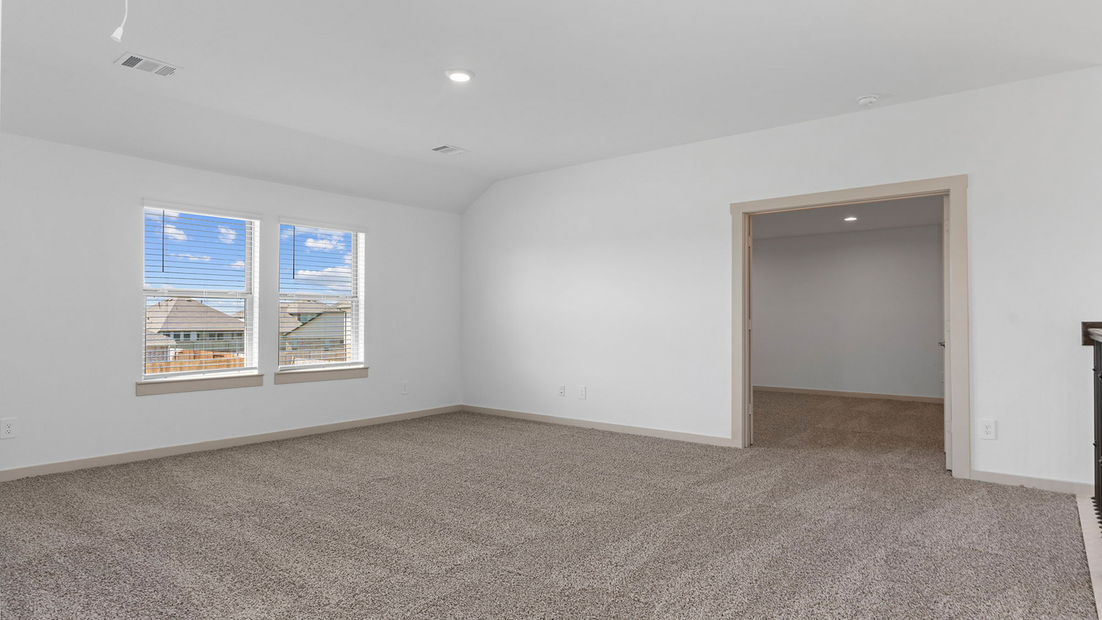 Upstairs game room with two large windows