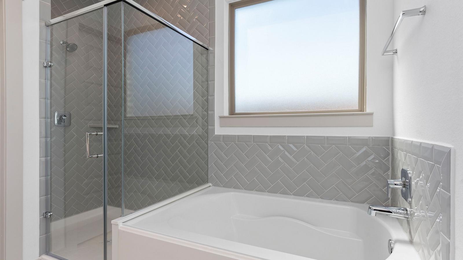 Primary bathroom with separate bathtub and shower and one large window