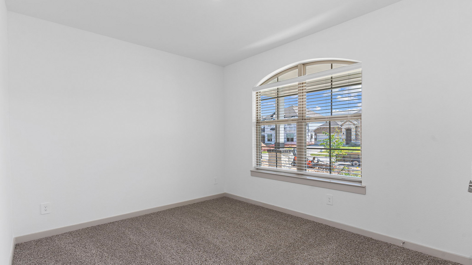 Secondary bedroom with two large windows