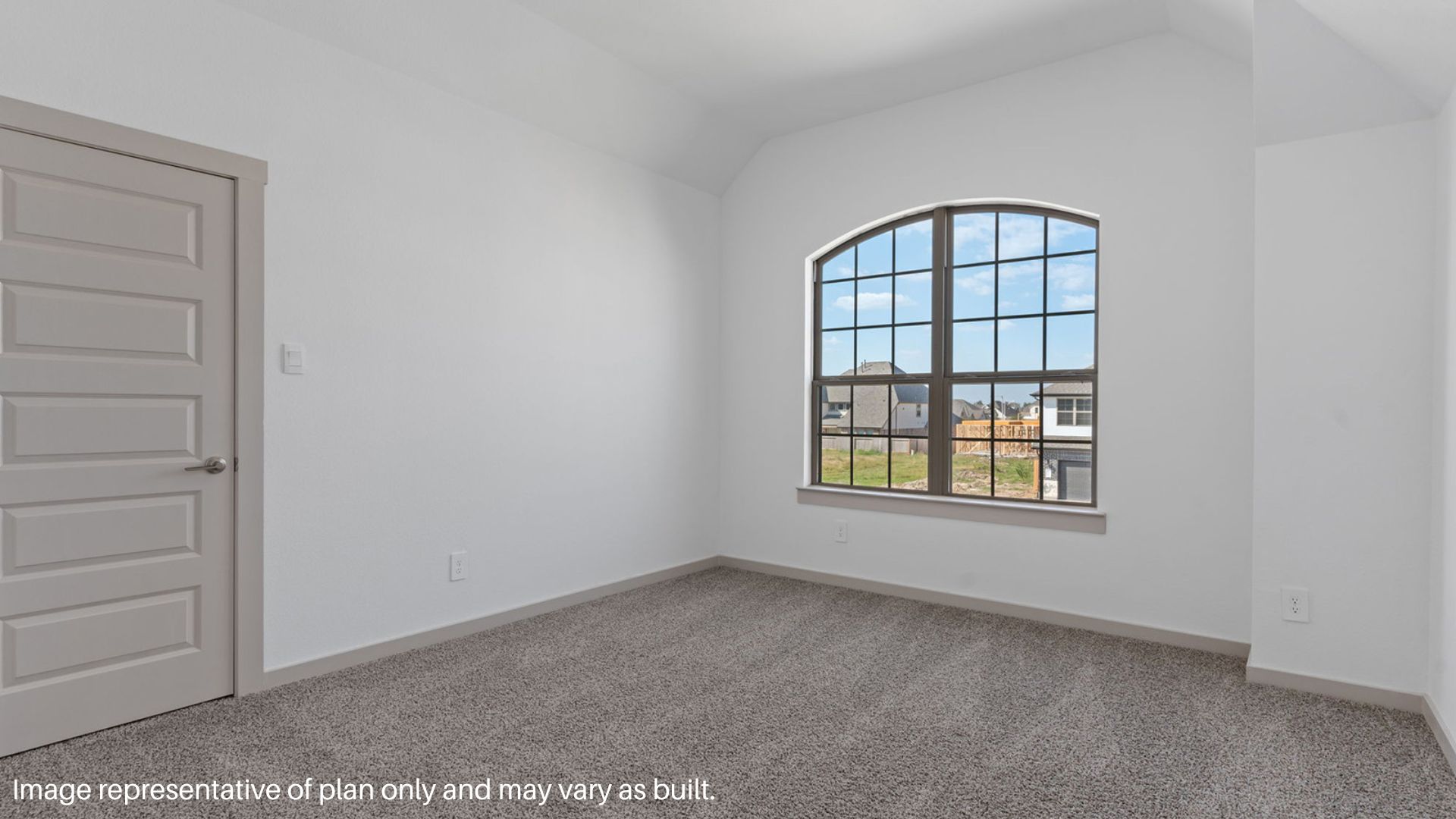 Secondary bedroom with carpet flooring and a bright window.