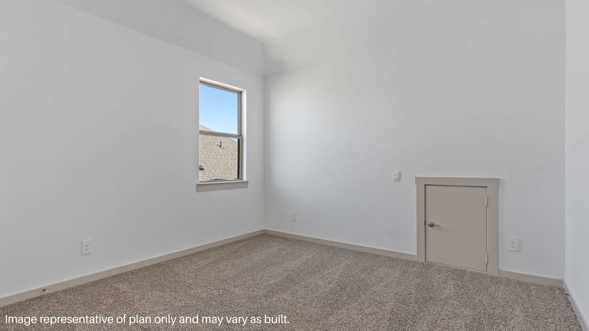 Secondary bedroom with carpet flooring and a bright window.