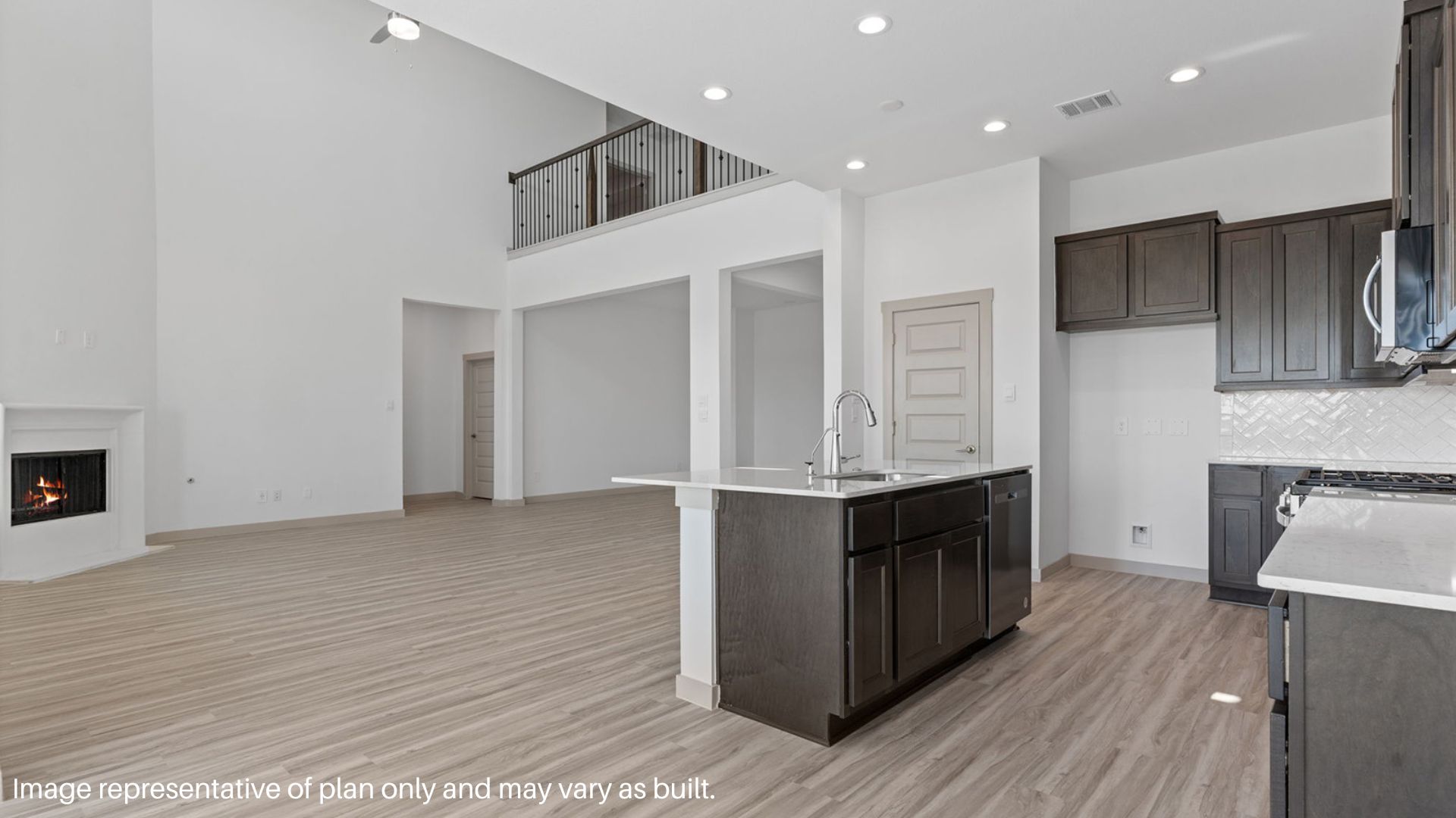Kitchen with island and stainless-steel appliances.