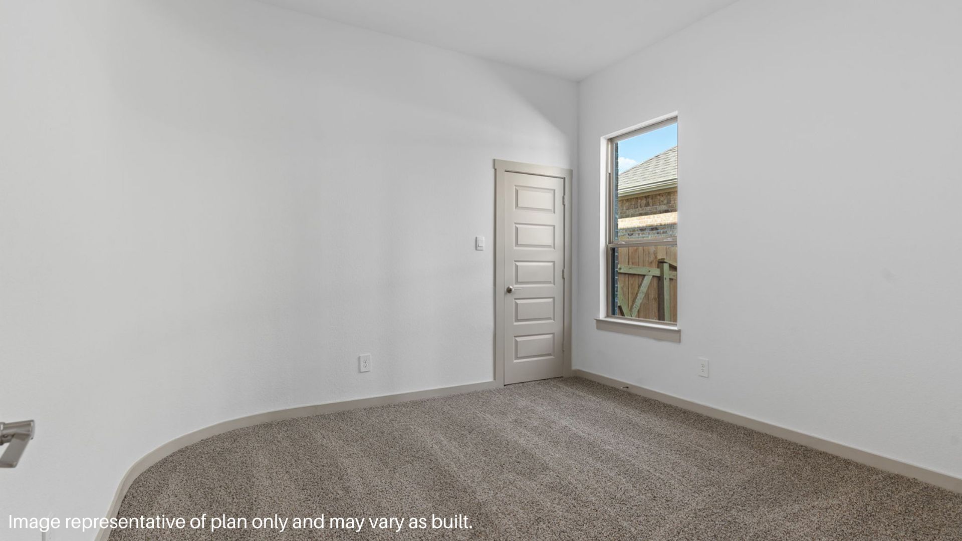 Secondary bedroom with carpet flooring and a bright window.