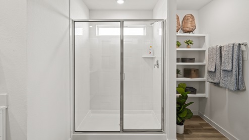 stand alone shower in primary bedroom