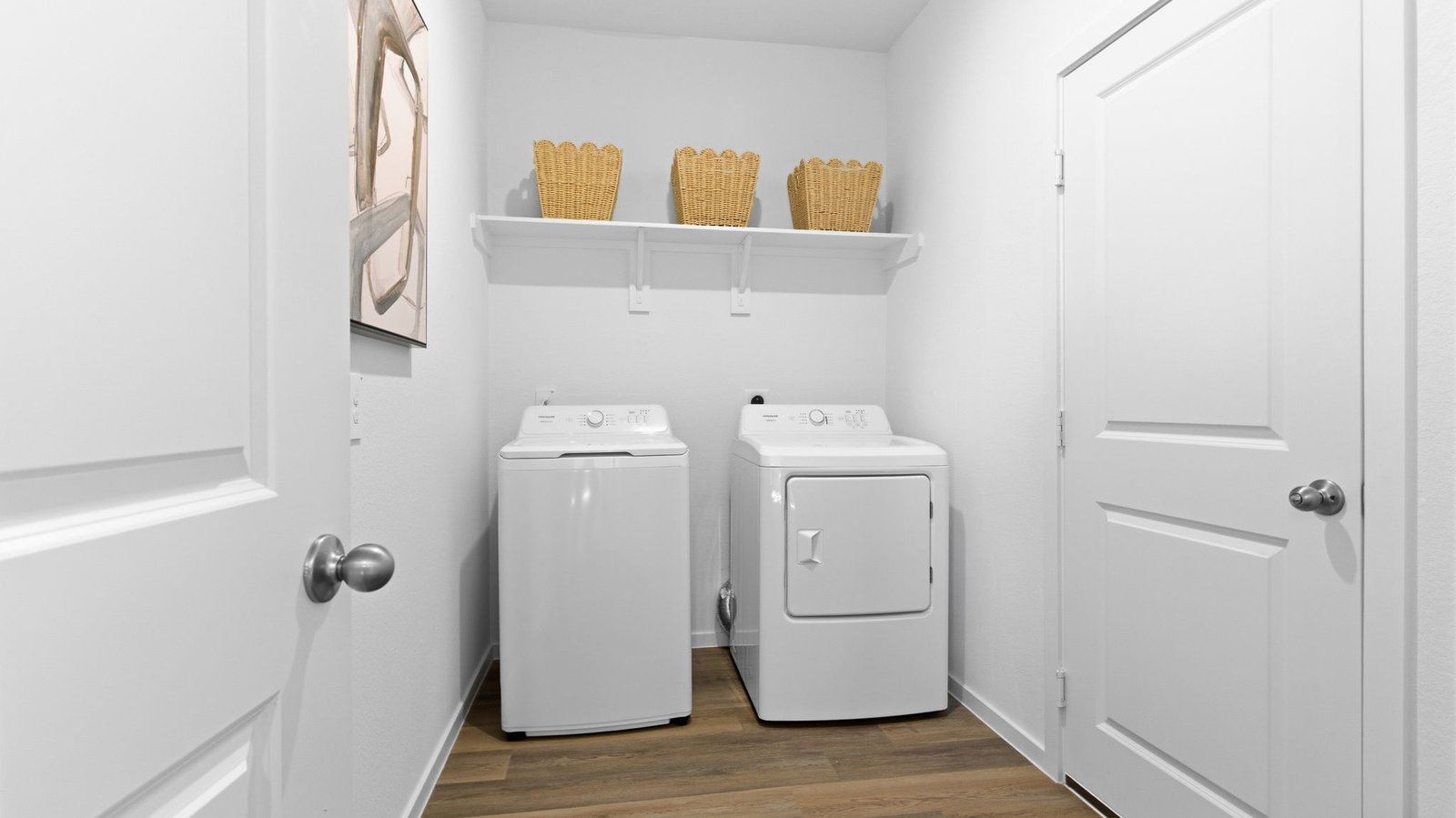 Oversized laundry room with space for cabinets and storage