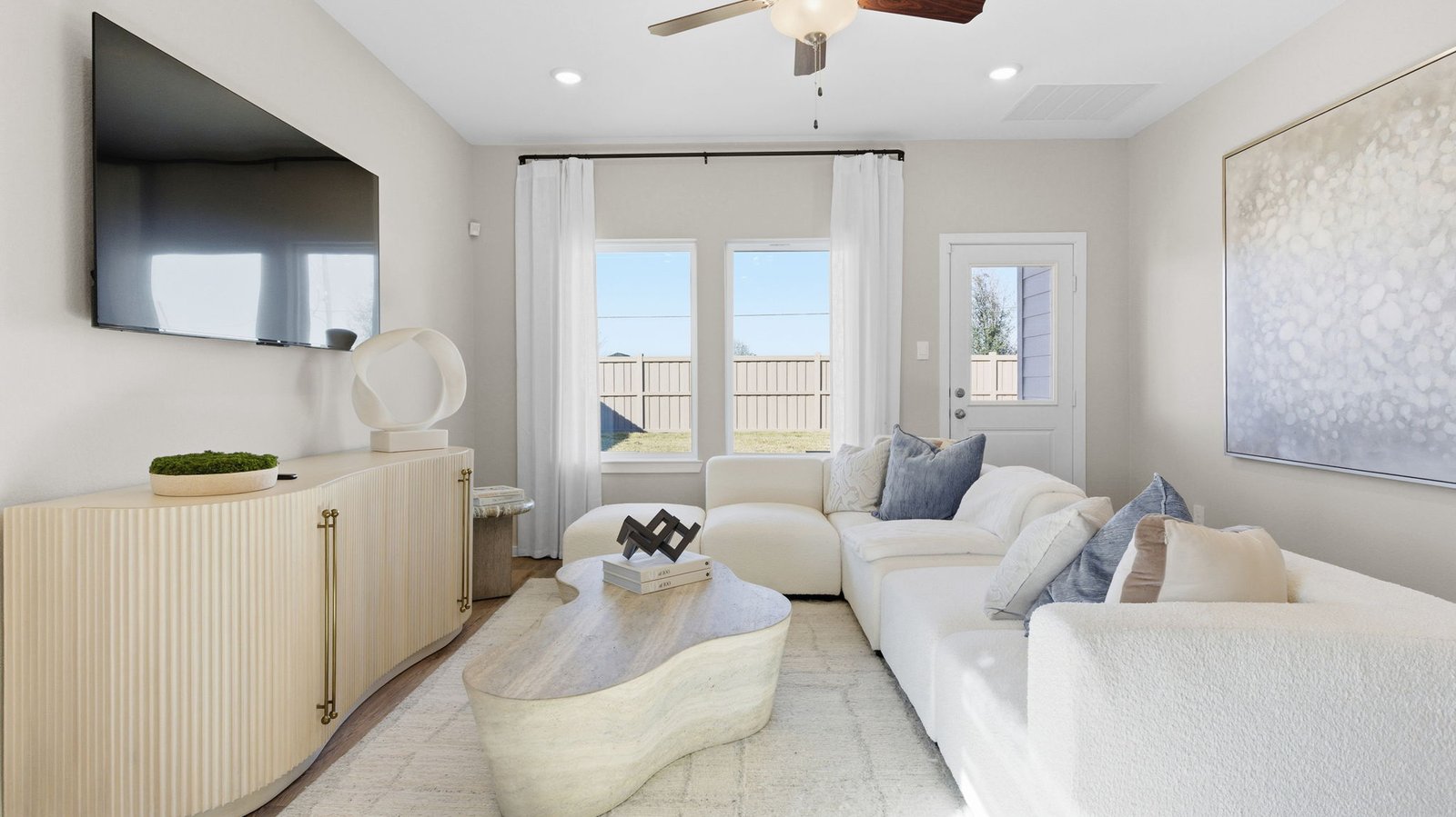 .Bright living room area that leads to the covered back patio