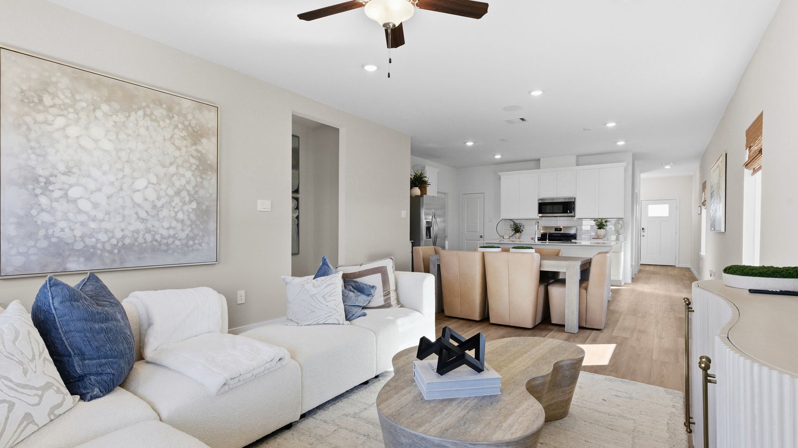 Bright living room area that leads to the covered back patio