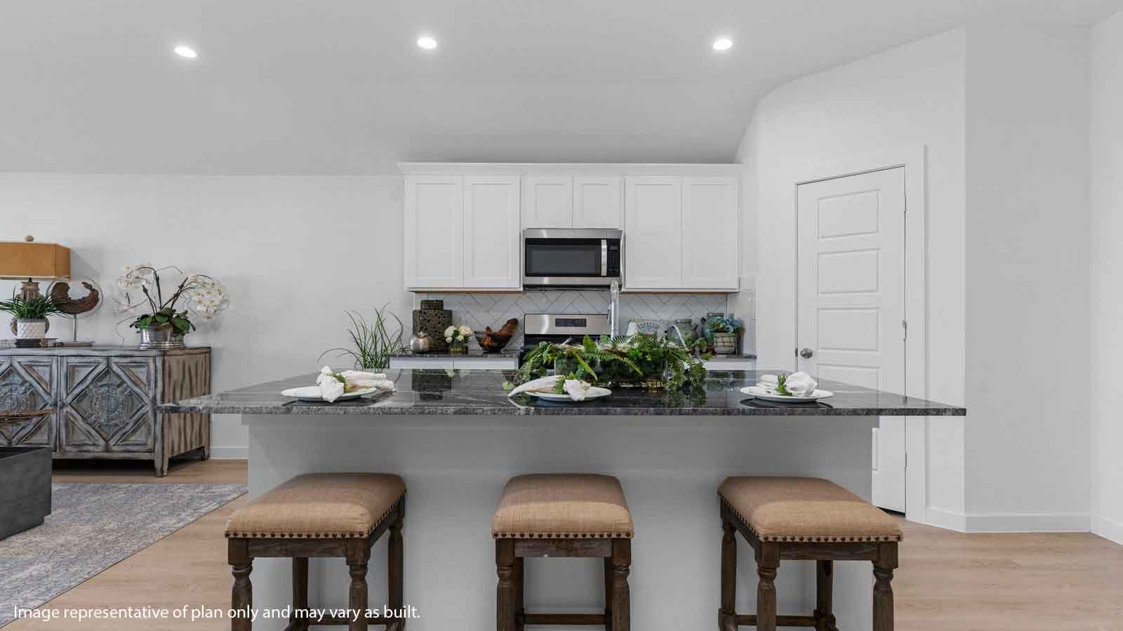 Kitchen with a large island and a deep sink