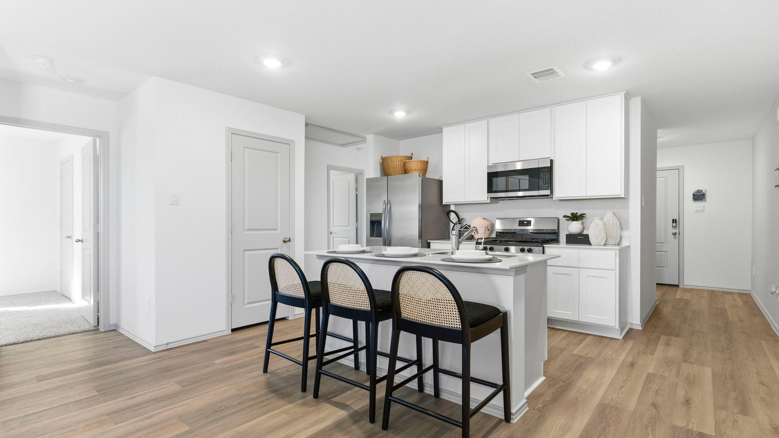 open concept kitchen with large island and stainless steel appliances
