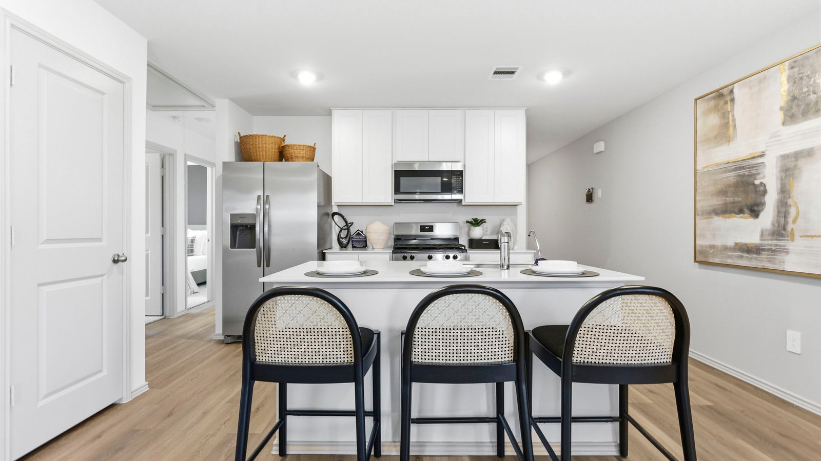 open concept kitchen with large island and stainless steel appliances