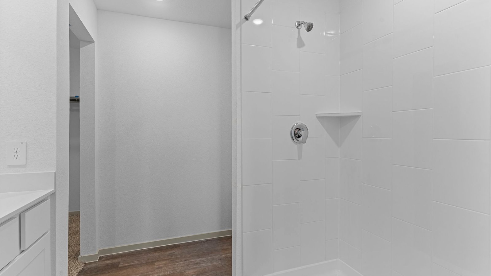 primary bathroom with one sink and stand up shower
