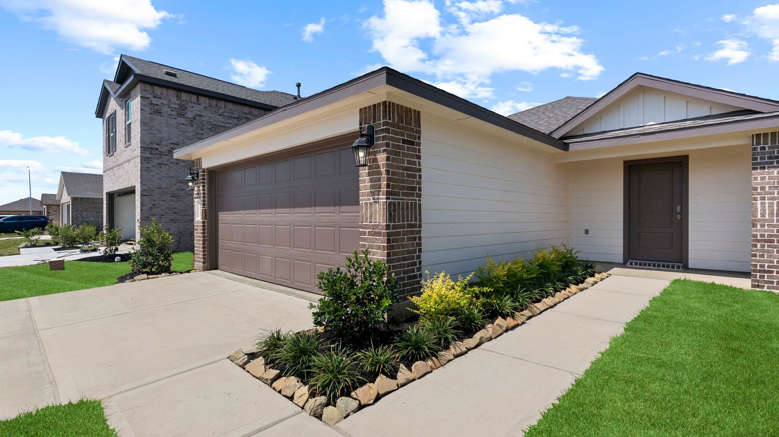 Single story brick home with a two car garage