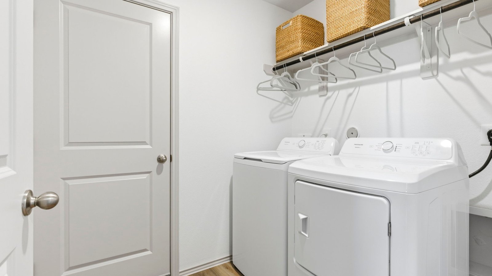 walk in laundry room that leads to the garage