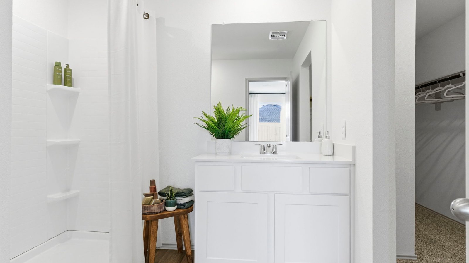 primary bathroom with shower and one sink