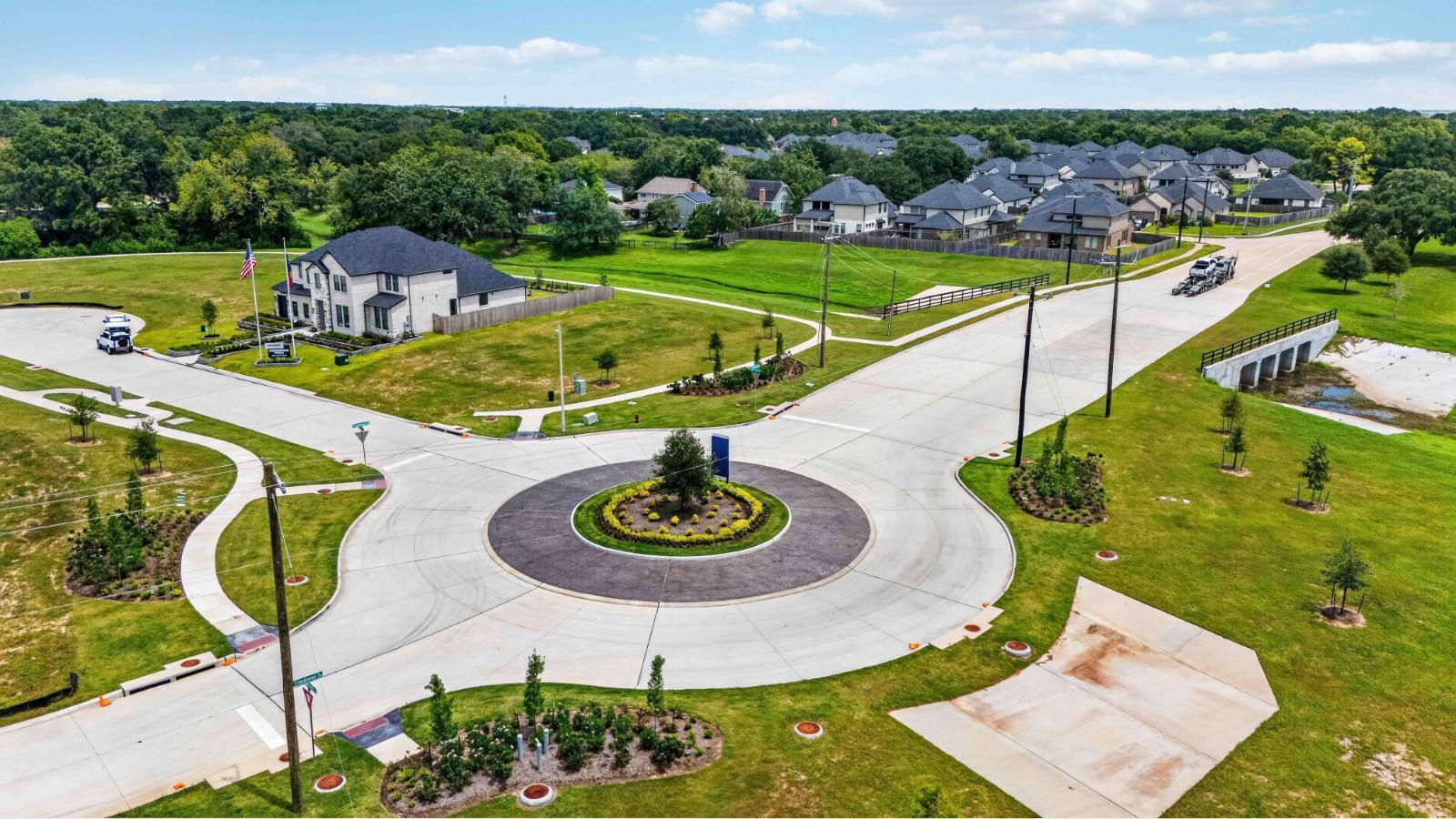 the community round about with a beautiful entry into the new home section