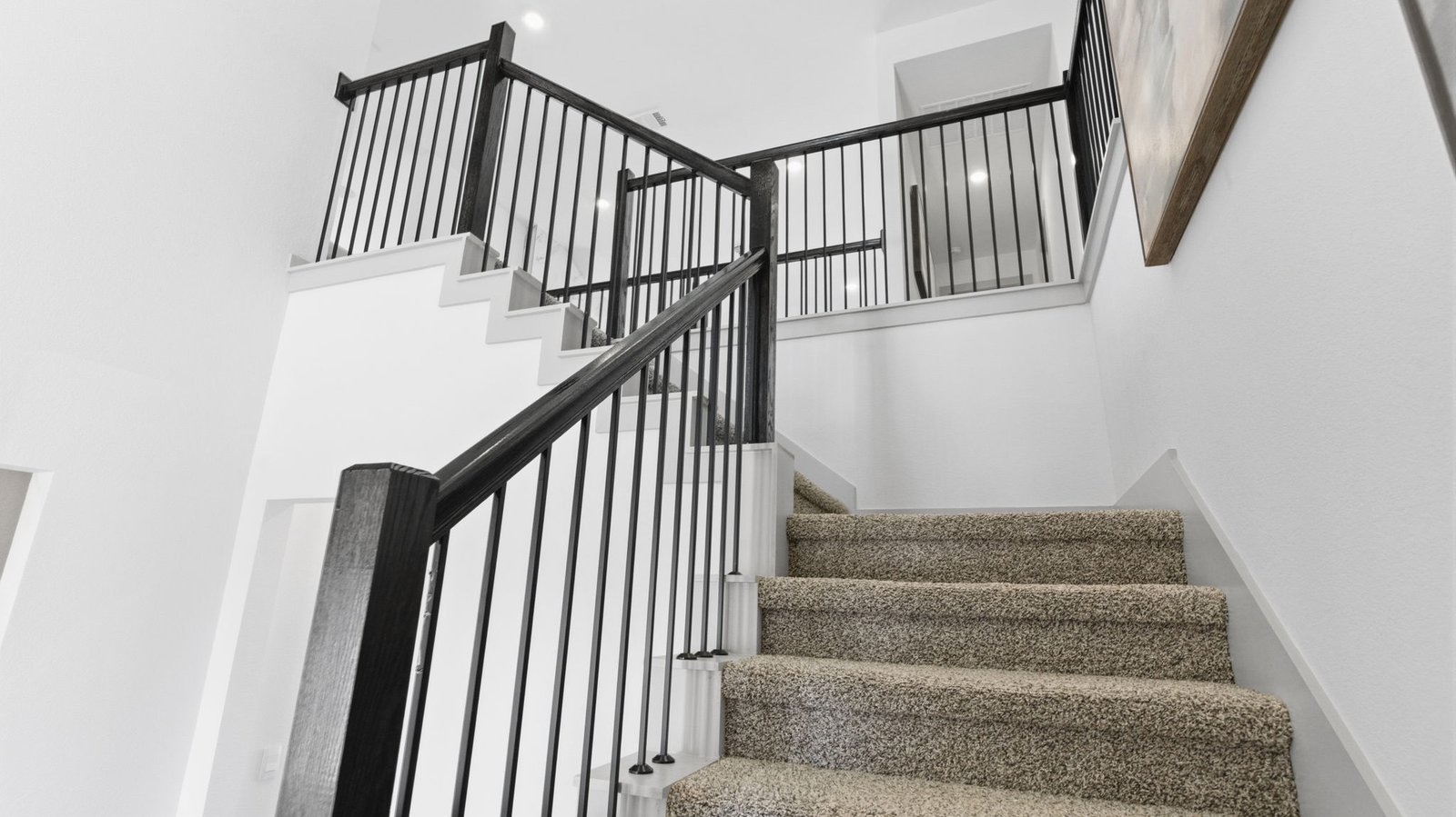 Spacious entry foyer with grand staircase leading to the second floor