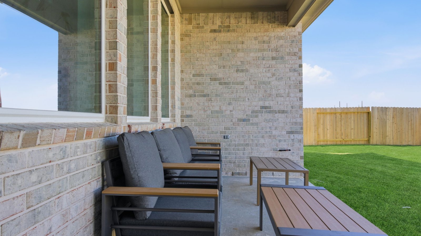 Covered back patio for relaxing evenings.