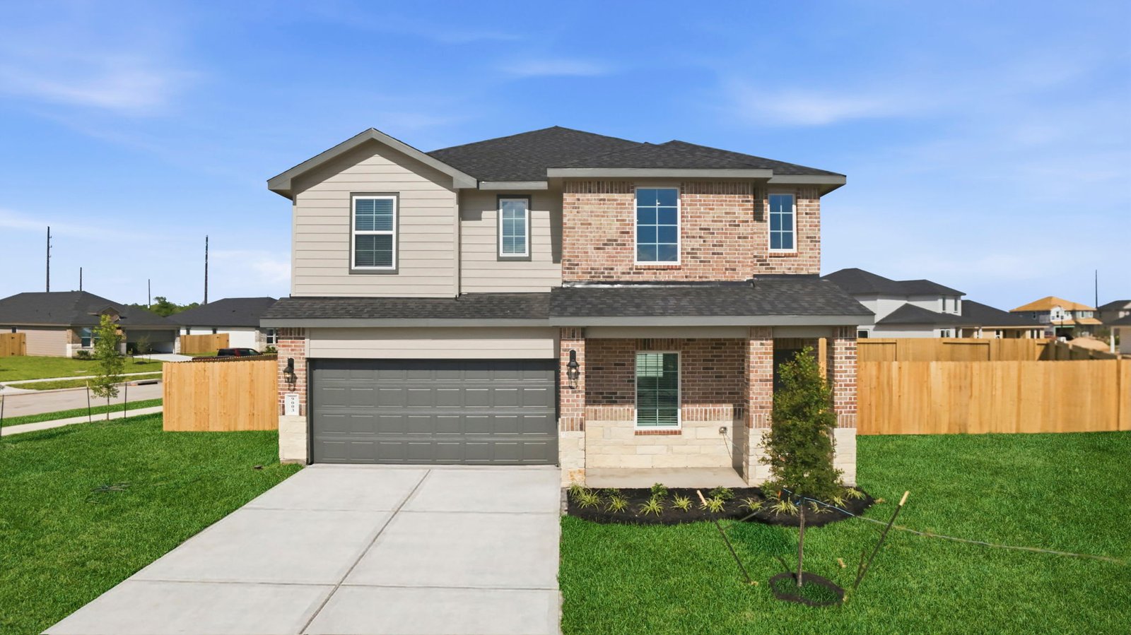 two story home with a two car garage