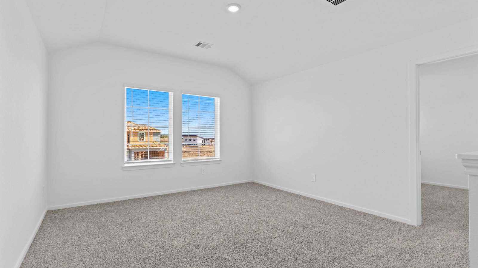 upstairs game room with two windows