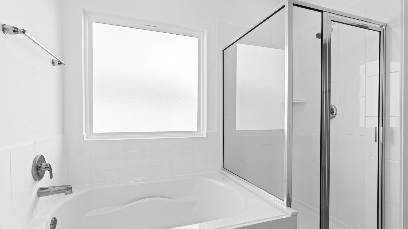 primary bathroom with separate bathtub and shower