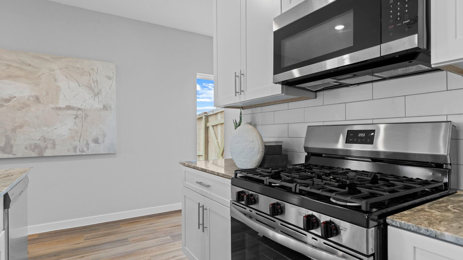 open concept kitchen with large island and stainless steel appliances