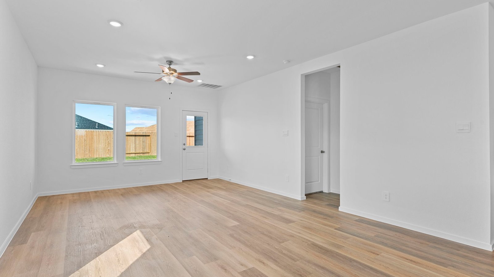 spacious living room with two windows
