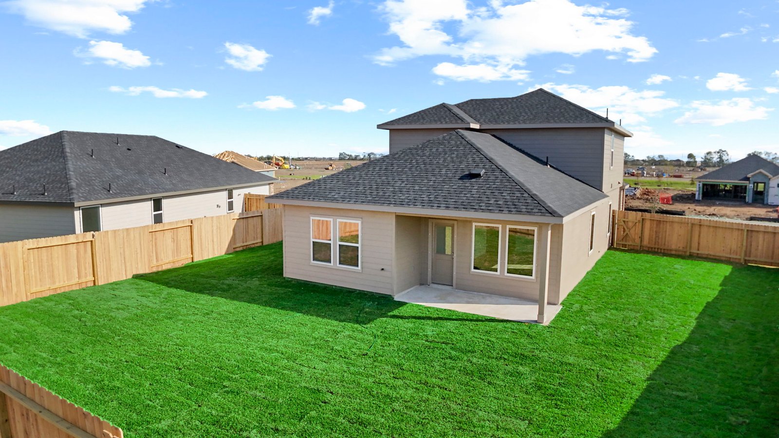 spacious backyard and covered patio