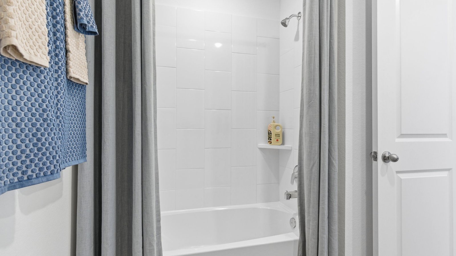 secondary bathroom with shower and tub
