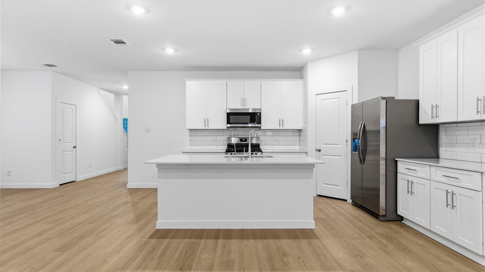 kitchen with large island and walk in pantry