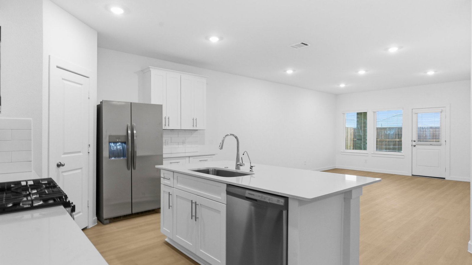 open concept kitchen and living room with large island