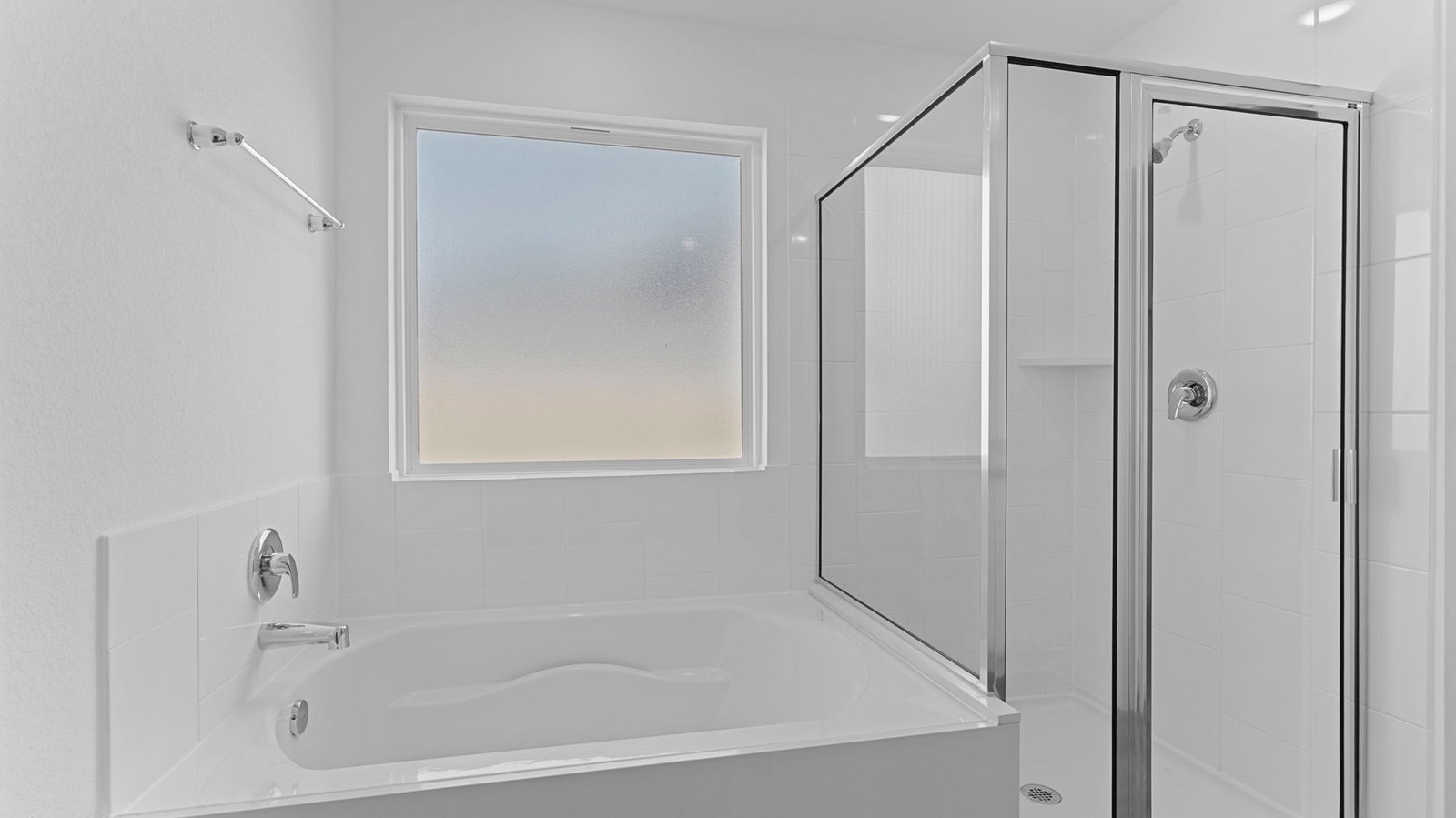 primary bathroom with tub and shower