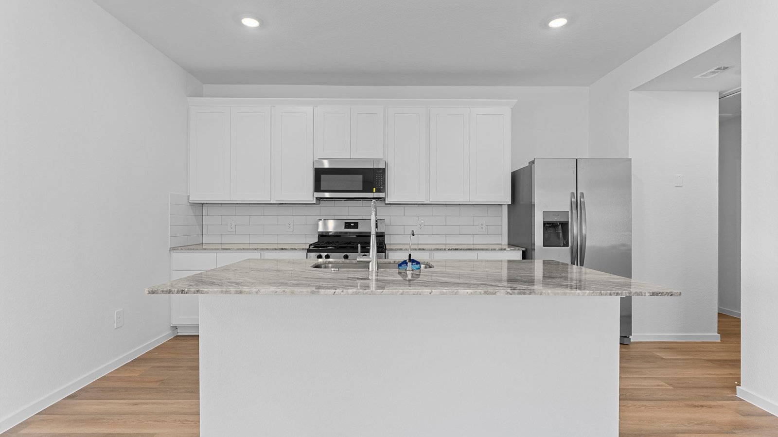 kitchen with large island and walk in pantry