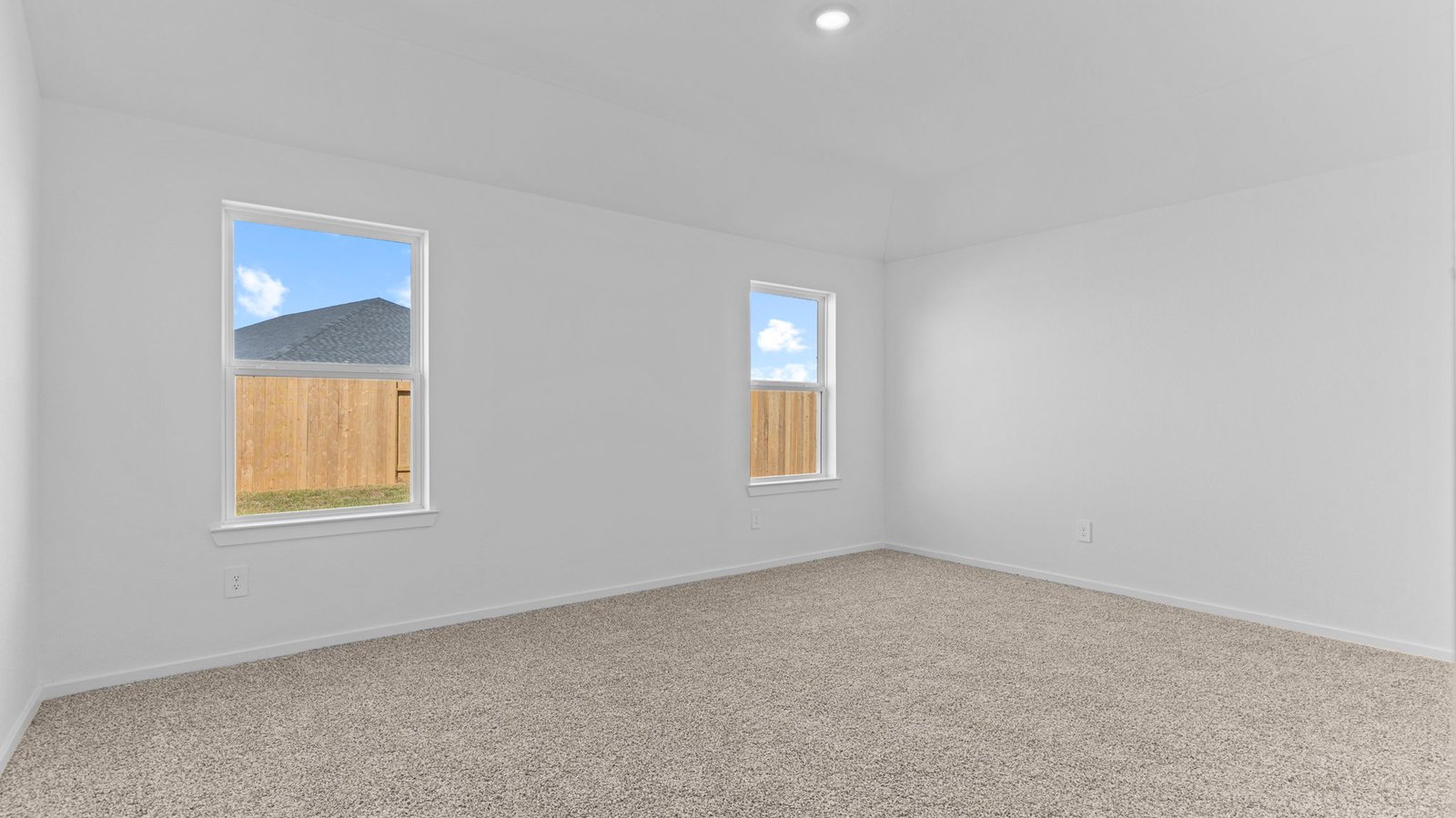 primary bedroom with two windows