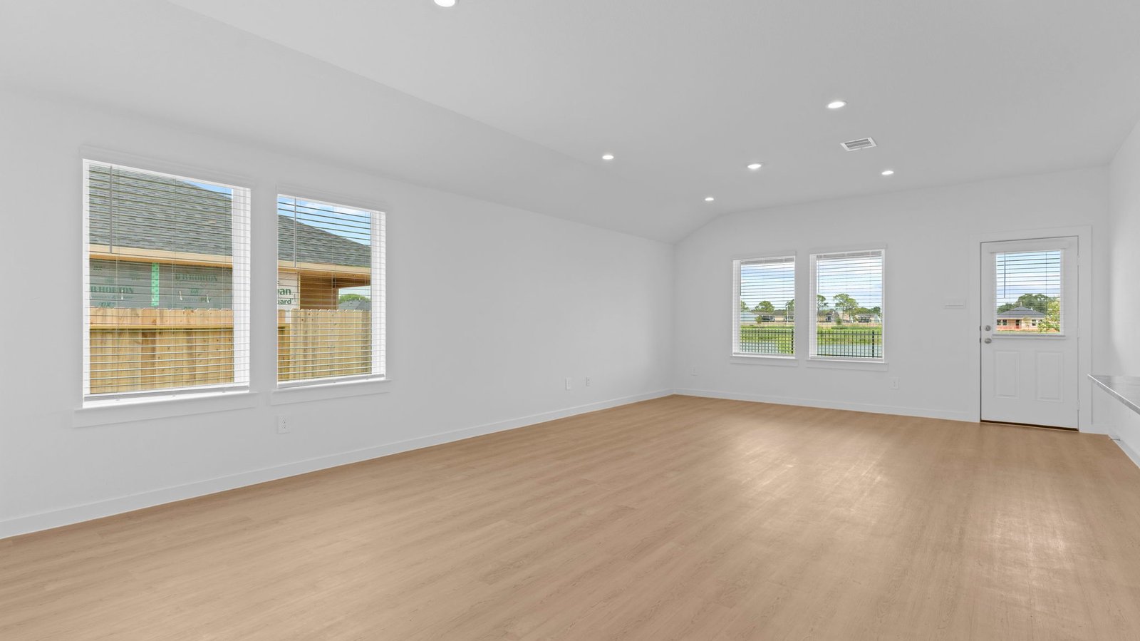 Open concept first floor with the living room, dining room and kitchen next to each other