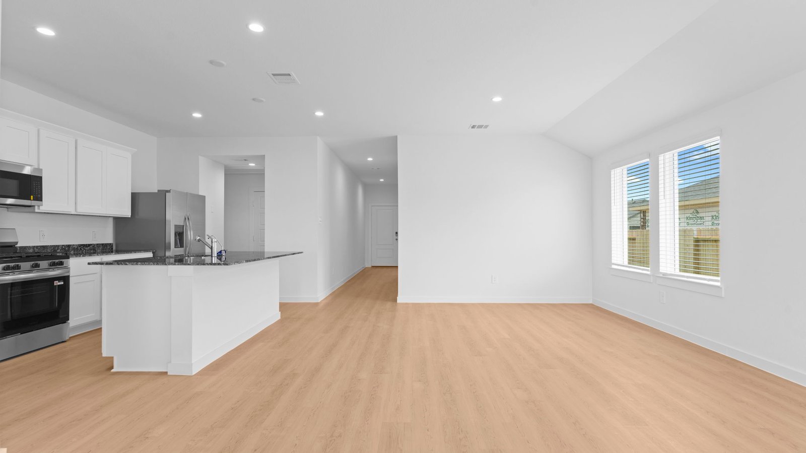 Open concept first floor with the living room, dining room and kitchen next to each other