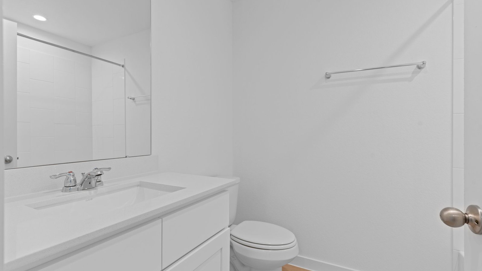 bathroom with a vanity sink, toilet and shower