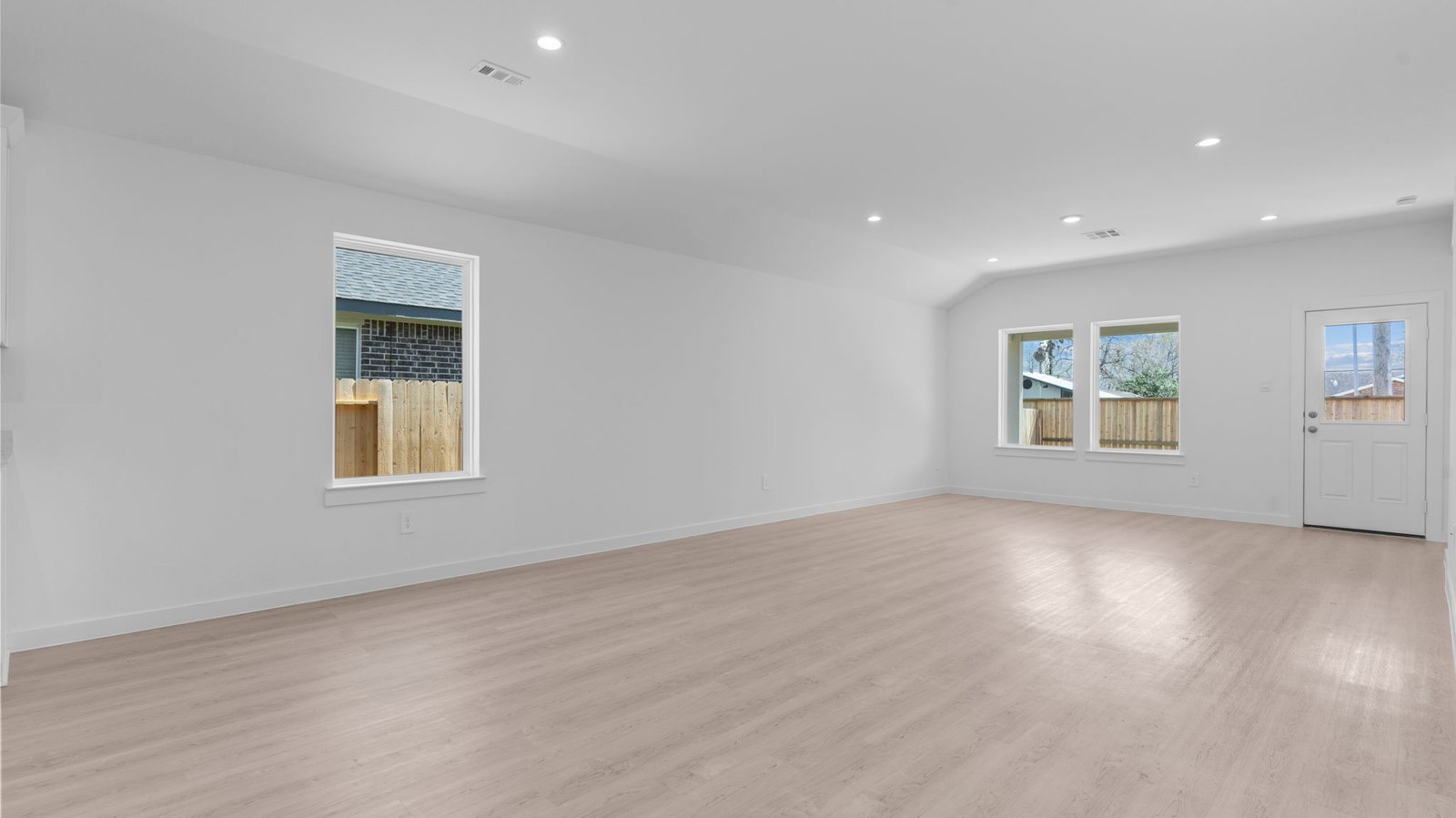 living room with multiple windows