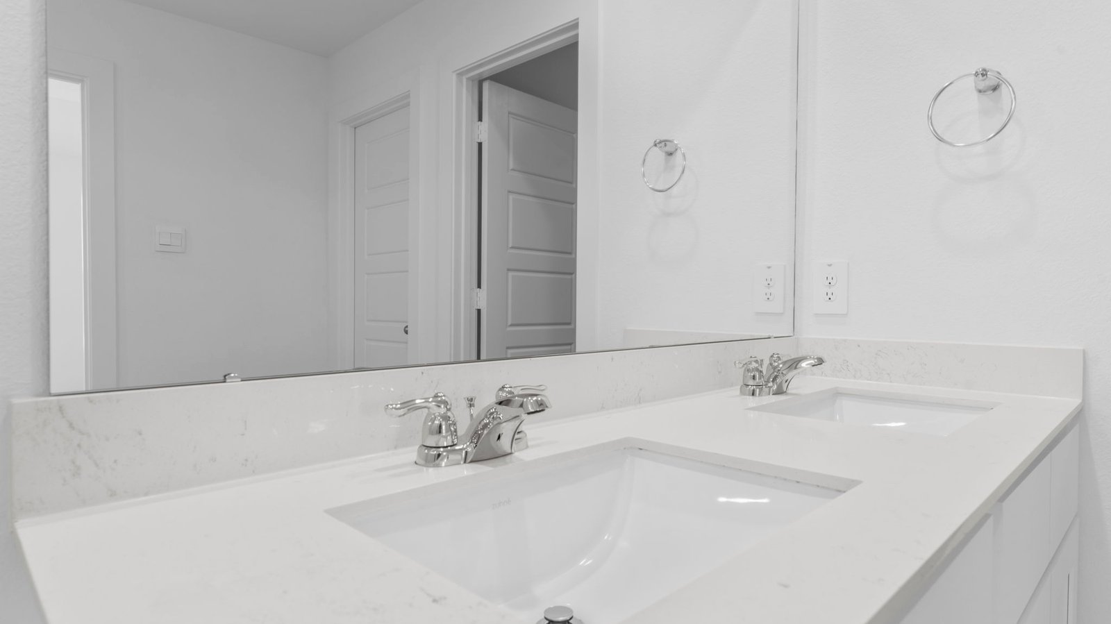 primary bathroom vanity with two sinks