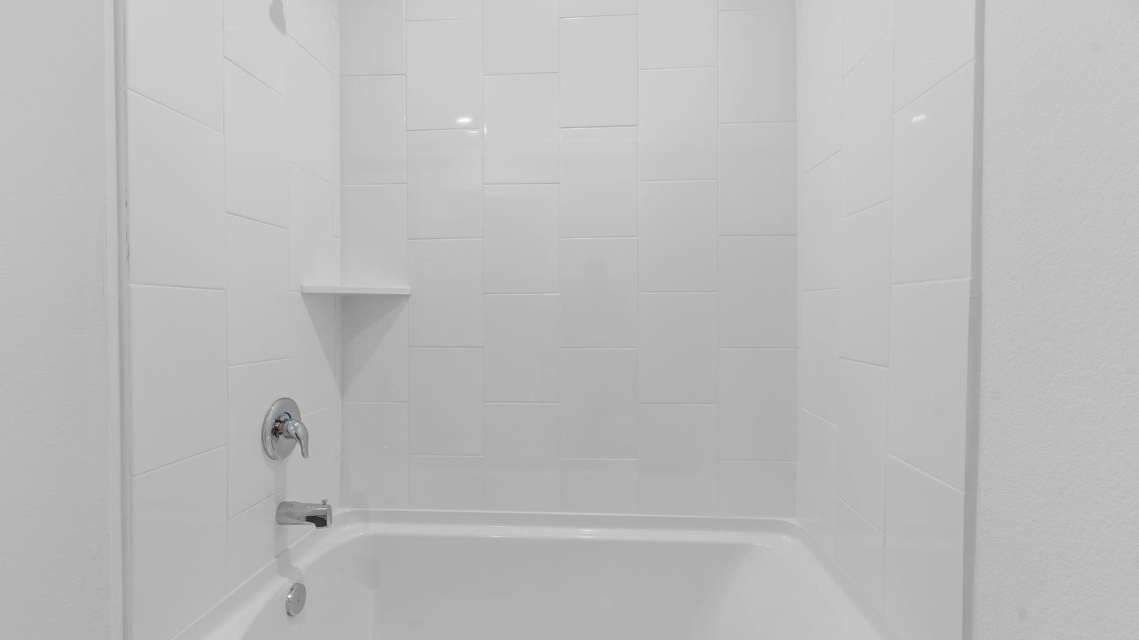 secondary bathroom with shower and tub combo